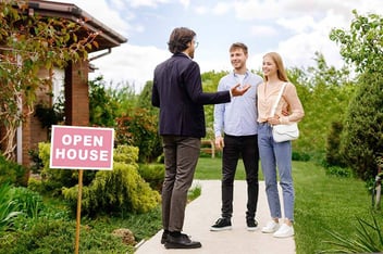 After researching if housing prices will drop in 2024, a couple attends an open house for a property they would like to buy.