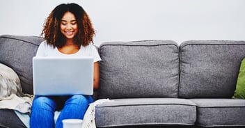 After researching how to apply for a HELOC, a woman fills out a HELOC application online.