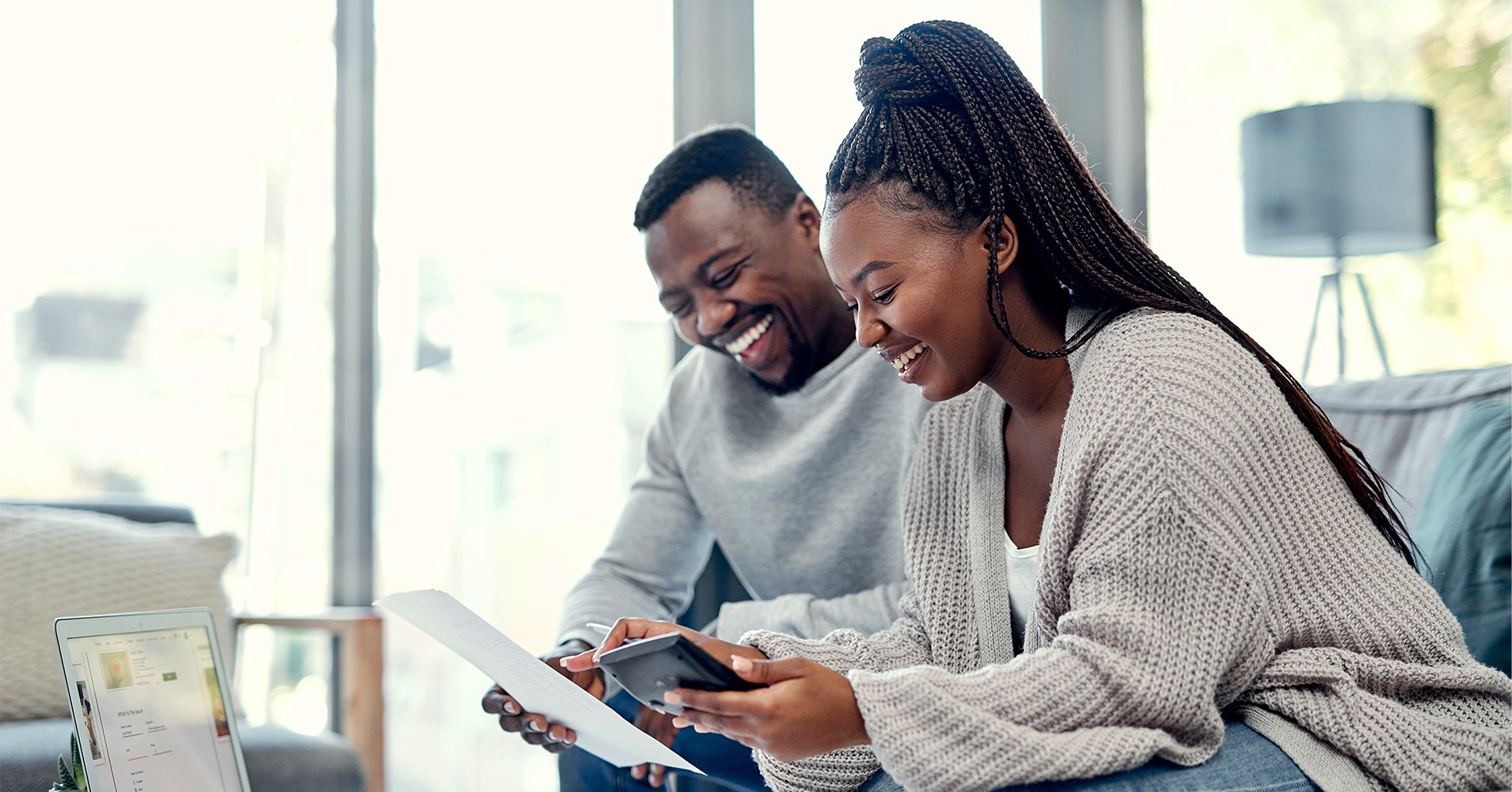 After researching how to get the best mortgage rates in Florida, a couple walks across the lawn of their new house in Gainesville.